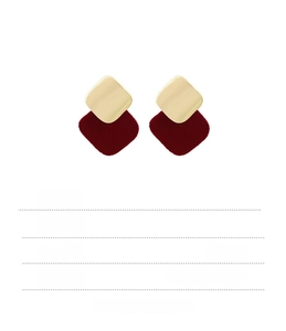 Detail view of burgundy flocked square earrings with gold metal accents and size labels