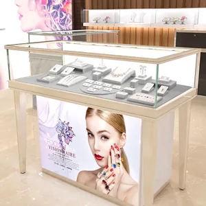 Minimalist white jewelry display cabinet with glass top and integrated poster light box