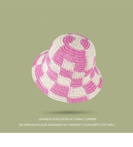 Detail of pink checkerboard crochet sun hat with black glue lining for UV protection