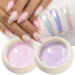 Solid aurora nail powder in pink pearl and holographic purple finish for manicures