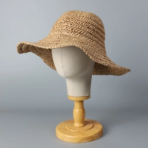 Minimalist wide brim hand-woven straw hat for women beach sun protection and summer vacation
