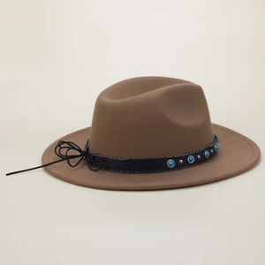 Close-up of brown wool felt fedora with turquoise beads and silver metal studs on leather band