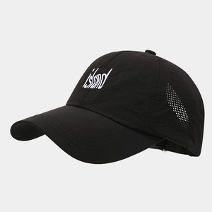 Detail view of laser-cut side vents and white island embroidery on black quick-dry cap
