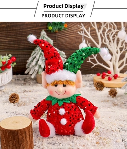 Close-up of a Christmas elf doll with sequins and velvet boots in a snowy winter scene