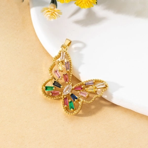 Macro shot of 3D butterfly pendant in gold copper set with colorful rectangular zircons