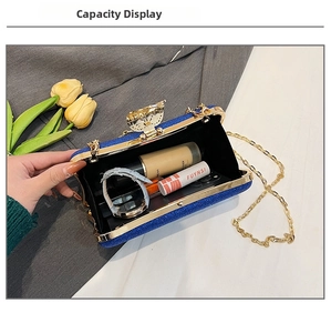 Blue glitter evening clutch showing interior space for phone and makeup items