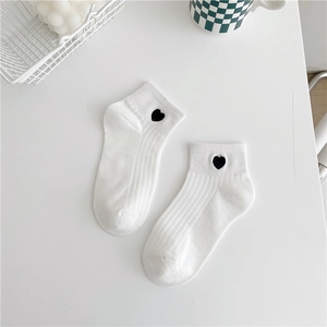 White cotton ankle socks for women with small black heart embroidery and ribbed texture
