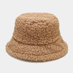 Close-up detail of the thick and soft camel faux lamb wool fabric on the winter bucket hat