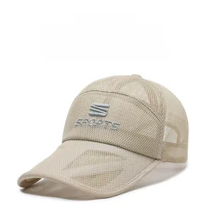 Detail of breathable mesh fabric on beige summer sports cap with S SPORTS embroidery