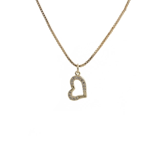 Close-up of golden heart locket necklace featuring sparkling cubic zirconia stones