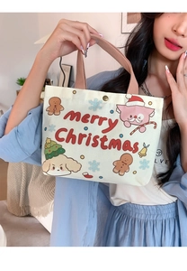Detail of canvas bag featuring Merry Christmas print with cute cartoon animals and metal snap