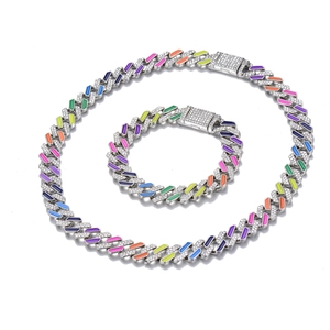 Close-up of hip hop cuban link necklace and bracelet set with rainbow enamel and CZ stones