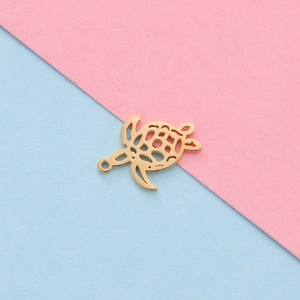 Macro shot of gold hollow turtle charm made of mirror polished stainless steel for jewelry DIY