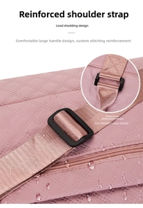 Detail of pink quilted sports bag showing reinforced stitching and waterproof fabric