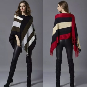 Women's knit poncho with color-block stripes and tassel fringe shown in front and back views