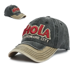 Detail of vintage washed baseball cap with 3D embroidery and distressed brim texture