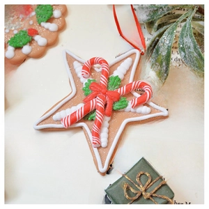 Detailed view of gingerbread star ornament with candy cane and festive background decor