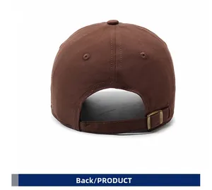 Detailed back view of a brown cotton baseball cap showing vintage copper adjustable buckle