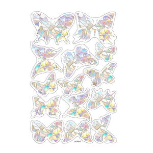 Close-up of 13 holographic rainbow butterfly window stickers with geometric facets