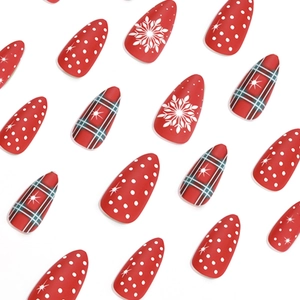 Christmas matte almond press-on nails with red green plaid and white snowflake patterns