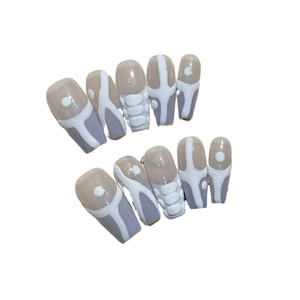Handmade coffin press-on nails in blue and white with textured sweater embossed pattern