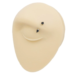 Minimalist black stainless steel eyebrow ring shown on a silicone piercing practice model