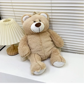 Detail of plush teddy bear backpack in khaki with soft texture and shoulder straps