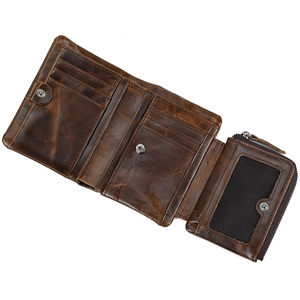 Detailed interior view of a vintage dark brown leather wallet with card slots and snap pocket