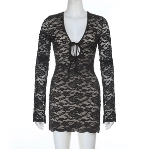 Macro shot of rose floral lace texture and ribbon tie detailing on a V-neck mini dress