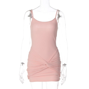 Detailed close-up of pink ribbed bodycon dress featuring elegant waist knot and ruched design