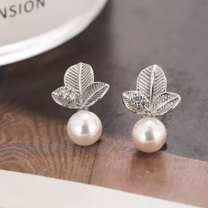 Elegant silver leaf stud earrings with white pearl and small sparkling crystal stones