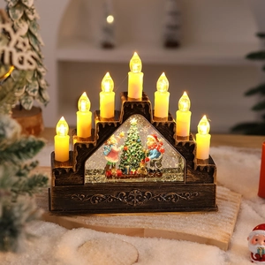 Detail of vintage Christmas water lantern with seven LED candles and snow scene