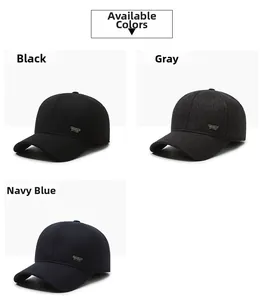 Detail view of winter baseball caps with ear flaps in black, grey, and navy blue wool fabric