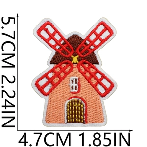 Detail view of windmill embroidery patch with dimensions 5.7cm by 4.7cm in macro shot