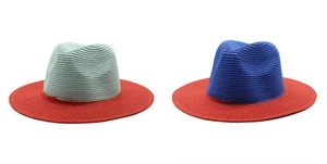 Detail of two-tone woven Fedora sun hats featuring wide brims and contrasting colors