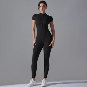 Detail of black athletic bodysuit featuring a half-high neck and front zipper closure