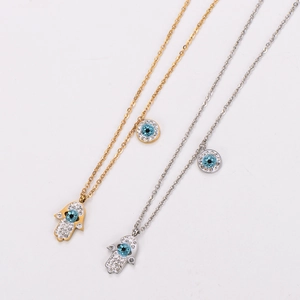 Gold and silver stainless steel evil eye Hamsa necklaces with blue and white zircons