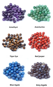 Macro display of assorted 14mm natural stone spheres including Amethyst and Tiger Eye