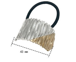 Detail of two-tone metal hair tie showing 43mm width and textured surface finish