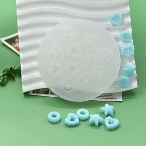 Detail of translucent silicone mold with star and heart shapes for DIY donut baking