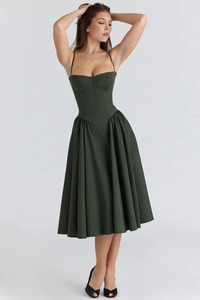 Detail of dark green corset style midi dress with structured bodice and flared A-line skirt