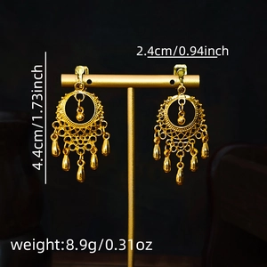 Detail view of retro hollow water-drop tassel earrings with exact size measurements