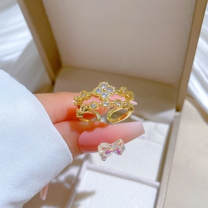 Adjustable gold clover ring with crown design and sparkling pavé stones for women