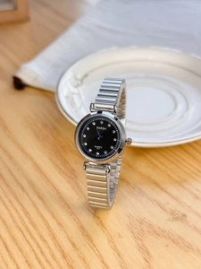 Detail shot of Barsh women quartz watch with black rhinestone dial on wood surface