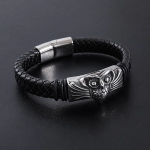 Men's black braided leather bracelet with silver stainless steel owl motif and magnetic clasp