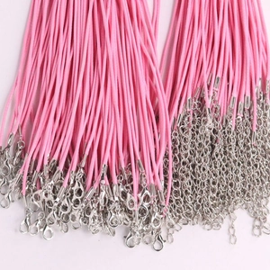 Detailed view of multiple pink leather cords with lobster clasps for DIY necklaces