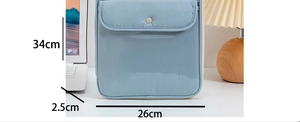 Detailed view of Morandi blue laptop sleeve with snap button and size markings