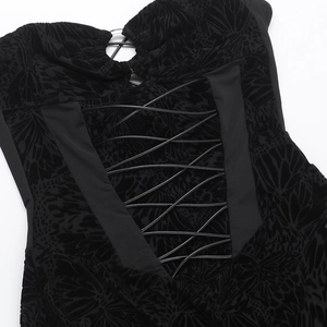 Detail of black burnout velvet fabric with intricate criss-cross lace-up design