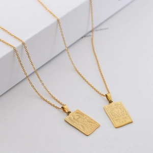 Irregular gold zodiac pendant necklace in stainless steel featuring Taurus and Leo signs