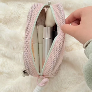 Pink mesh makeup bag with pearl zipper and large capacity for travel toiletries